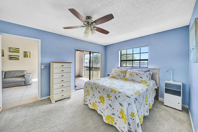 3050 Norwood Pl Unit N208, Boca Raton, FL 33431 - carpeted bedroom featuring access to outside, ceiling fan, baseboards, and a textured ceiling
