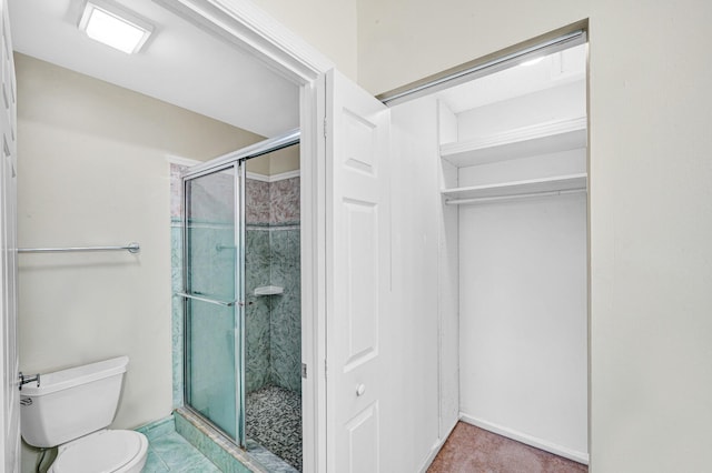 3050 Norwood Pl Unit N208, Boca Raton, FL 33431 - bathroom with a shower stall, baseboards, and toilet