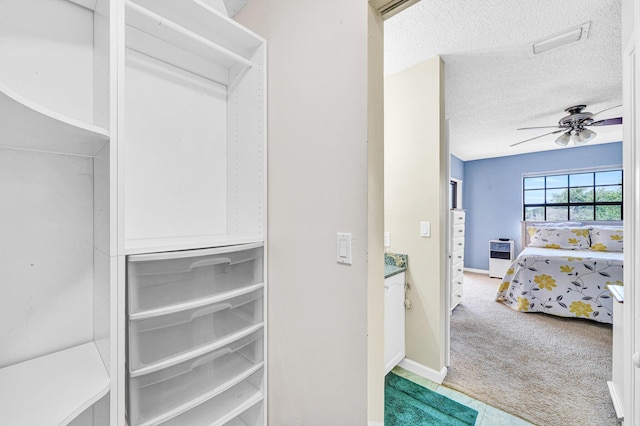 3050 Norwood Pl Unit N208, Boca Raton, FL 33431 - walk in closet featuring light colored carpet, ceiling fan, visible vents, and heating unit