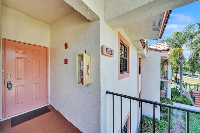3050 Norwood Pl Unit N208, Boca Raton, FL 33431 - property entrance featuring a tile roof and stucco siding