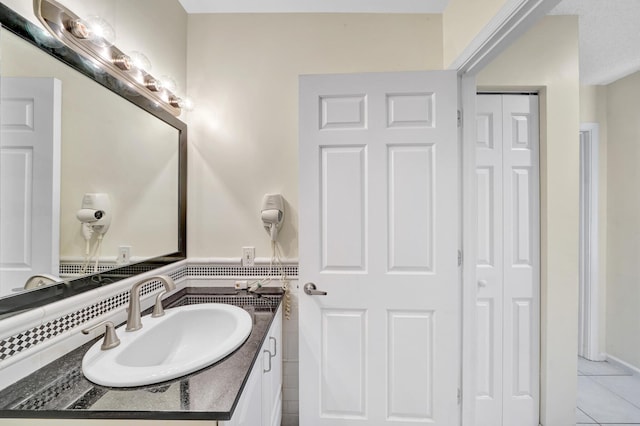 3050 Norwood Pl Unit N208, Boca Raton, FL 33431 - bathroom with a closet, vanity, and tile patterned flooring