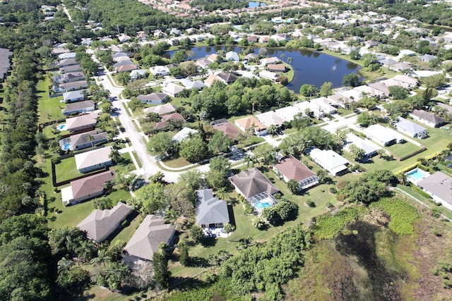 bird's eye view with a residential view and a water view