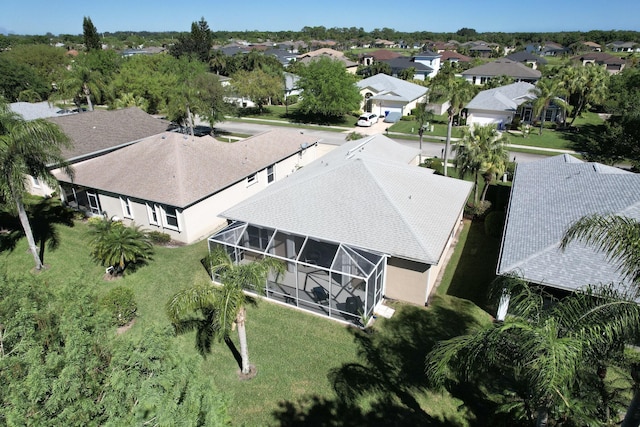 birds eye view of property with a residential view