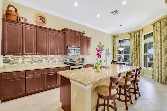 16988 SW Ambrose Way, Port Saint Lucie, FL 34986 - kitchen featuring visible vents, a sink, light tile patterned flooring, and stainless steel appliances