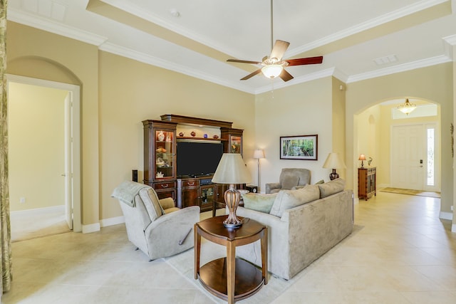 16988 SW Ambrose Way, Port Saint Lucie, FL 34986 - living room featuring a ceiling fan, arched walkways, light tile patterned floors, baseboards, and ornamental molding