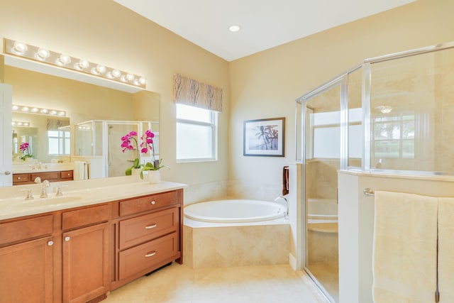 16988 SW Ambrose Way, Port Saint Lucie, FL 34986 - full bath featuring a garden tub, vanity, tile patterned flooring, and a stall shower