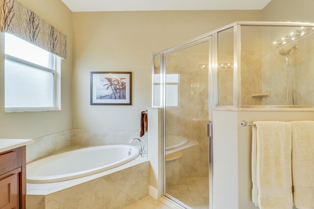 16988 SW Ambrose Way, Port Saint Lucie, FL 34986 - bathroom featuring a shower stall, a bath, and vanity