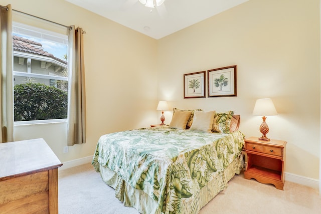 16988 SW Ambrose Way, Port Saint Lucie, FL 34986 - bedroom featuring baseboards, ceiling fan, and light carpet