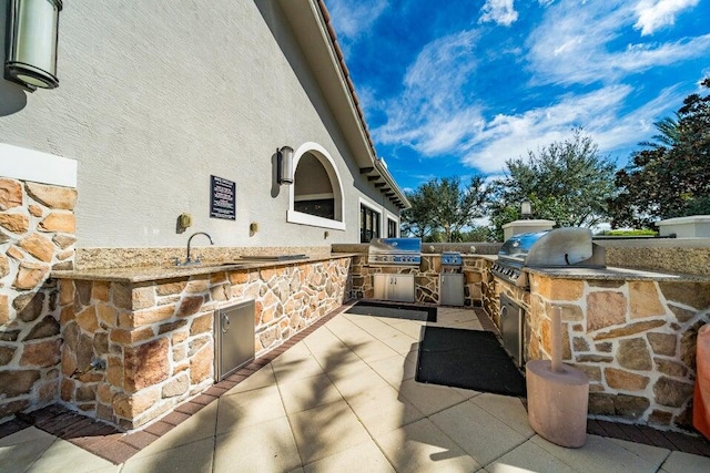 16988 SW Ambrose Way, Port Saint Lucie, FL 34986 - view of patio / terrace featuring a sink and area for grilling