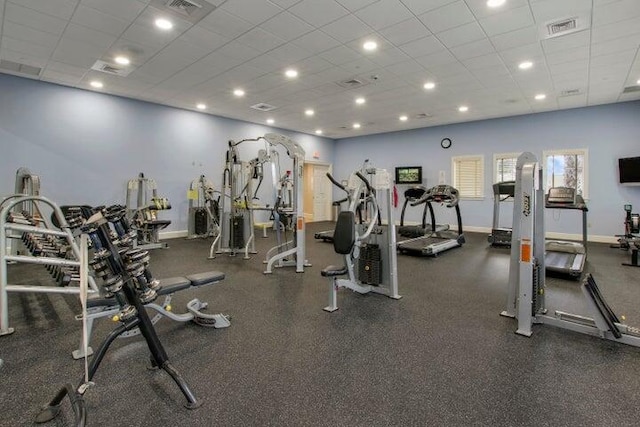 16988 SW Ambrose Way, Port Saint Lucie, FL 34986 - exercise room featuring visible vents, baseboards, and a drop ceiling