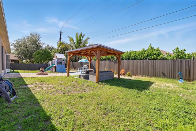 1041 SW Dartmouth Ave, Port Saint Lucie, FL 34953 - view of yard featuring a fenced backyard, a gazebo, and a playground