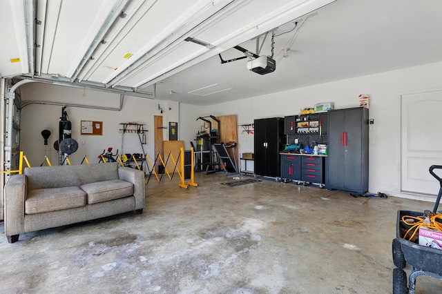 1041 SW Dartmouth Ave, Port Saint Lucie, FL 34953 - garage with a garage door opener and electric panel