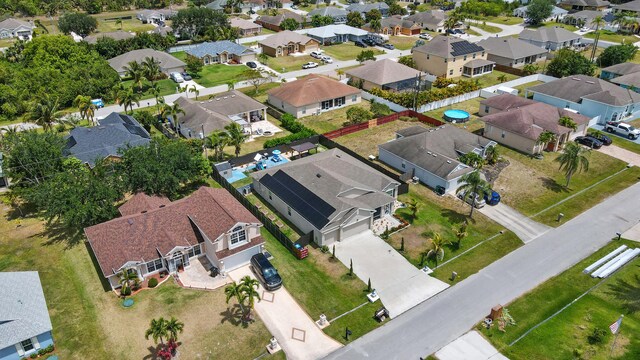 1041 SW Dartmouth Ave, Port Saint Lucie, FL 34953 - drone / aerial view featuring a residential view