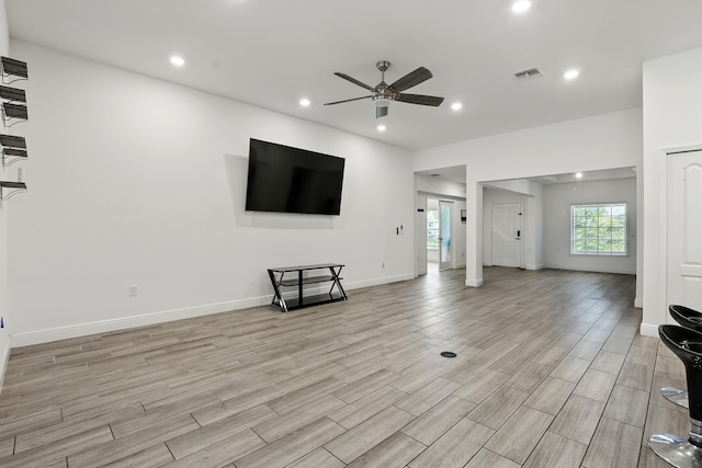 1041 SW Dartmouth Ave, Port Saint Lucie, FL 34953 - unfurnished living room featuring recessed lighting, light wood-style floors, visible vents, and a ceiling fan