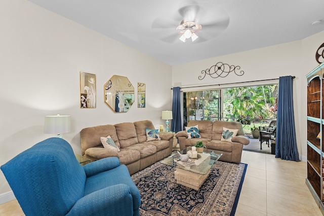 living room featuring baseboards, a ceiling fan, and light tile patterned flooring