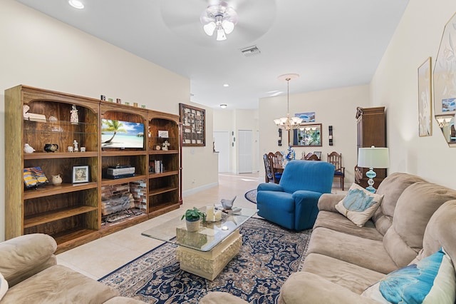 tiled living area with recessed lighting, visible vents, baseboards, and ceiling fan with notable chandelier