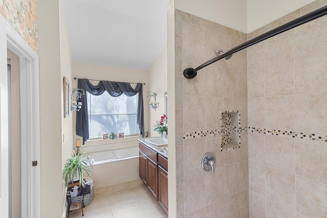 bathroom with a shower stall, a garden tub, tile patterned flooring, and vanity