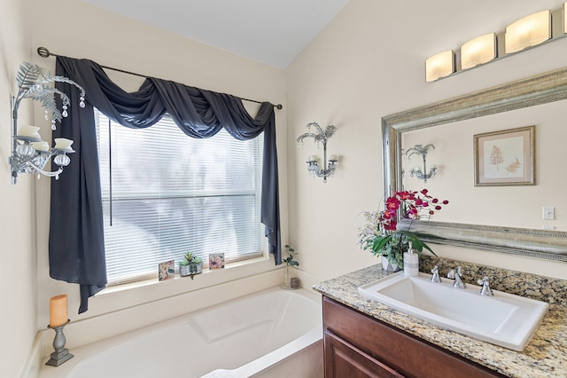 full bath with a bath and vanity