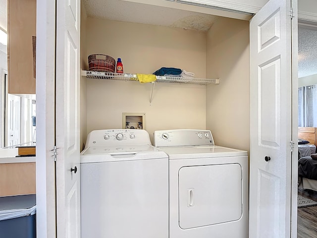 5005 Laguna Bay Cir Unit 26, Kissimmee, FL 34746 - laundry room with washing machine and dryer and laundry area