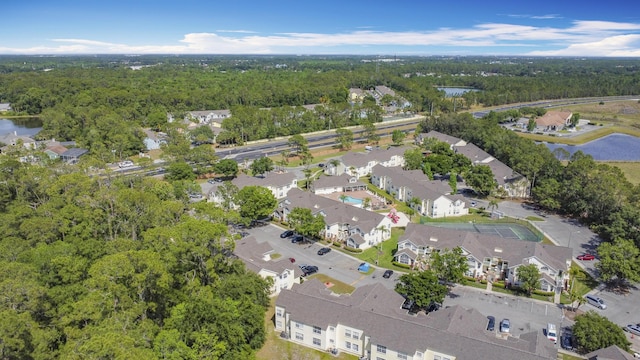 5005 Laguna Bay Cir Unit 26, Kissimmee, FL 34746 - bird's eye view featuring a view of trees and a residential view