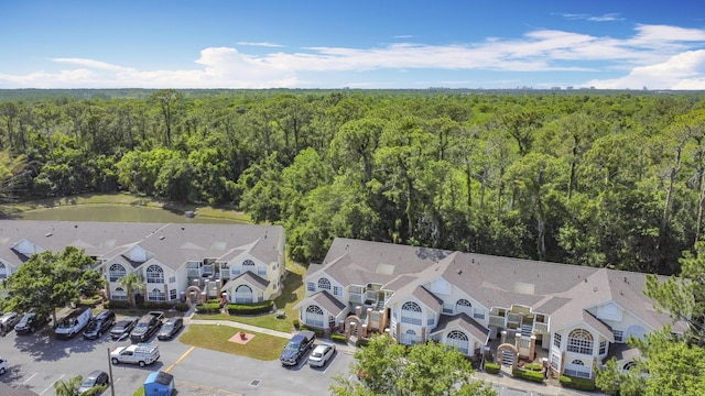 5005 Laguna Bay Cir Unit 26, Kissimmee, FL 34746 - drone / aerial view with a view of trees