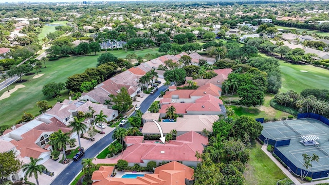 birds eye view of property with view of golf course and a residential view