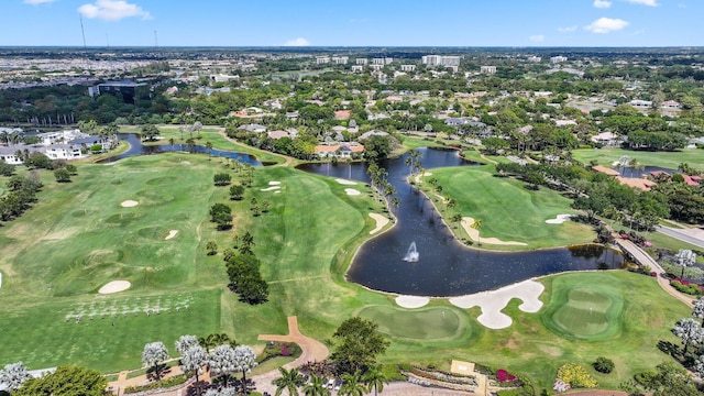 drone / aerial view featuring a water view and view of golf course