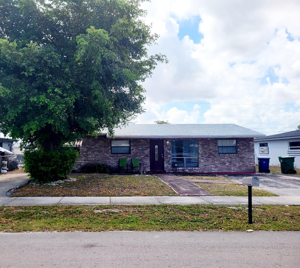 single story home with brick siding