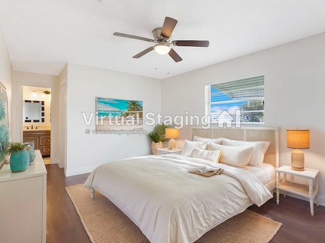 bedroom featuring dark wood-type flooring, baseboards, a sink, ensuite bath, and ceiling fan