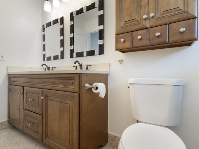 bathroom with toilet and vanity