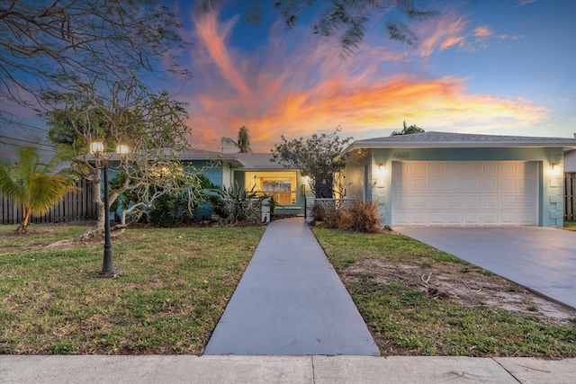 4800 Harrison St, Hollywood, FL 33021 - view of front facade featuring stucco siding, an attached garage, and driveway