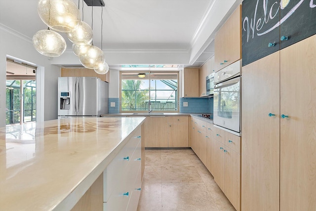 4800 Harrison St, Hollywood, FL 33021 - kitchen featuring stainless steel appliances, crown molding, light brown cabinets, backsplash, and a sink