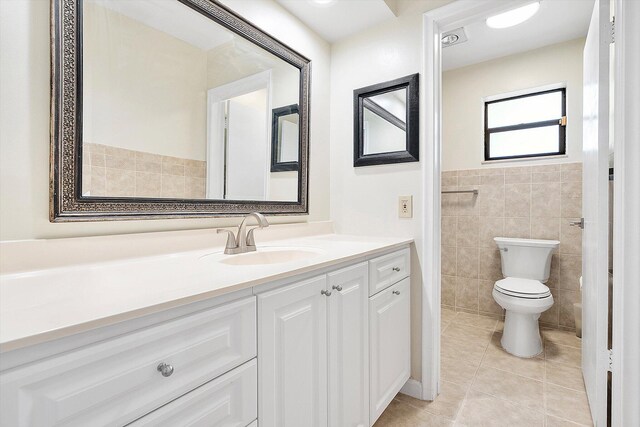 4800 Harrison St, Hollywood, FL 33021 - bathroom featuring tile walls, tile patterned floors, vanity, and toilet