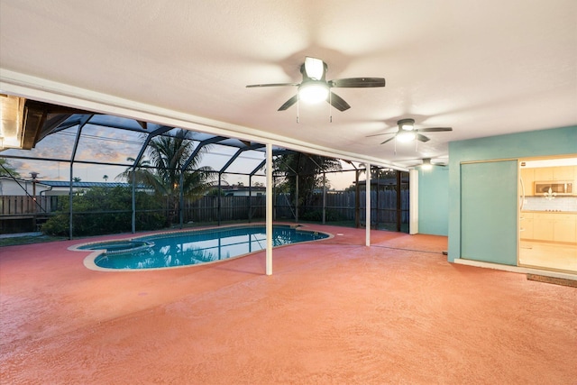 4800 Harrison St, Hollywood, FL 33021 - view of pool featuring a patio area, a ceiling fan, a pool with connected hot tub, and a lanai