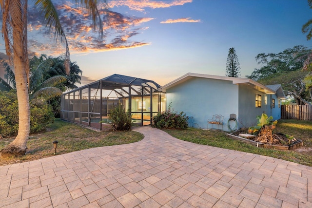 4800 Harrison St, Hollywood, FL 33021 - rear view of house featuring a patio area, stucco siding, a lanai, and a swimming pool