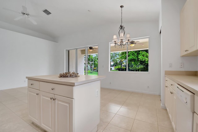 kitchen with ceiling fan with notable chandelier, visible vents, light countertops, white dishwasher, and decorative light fixtures