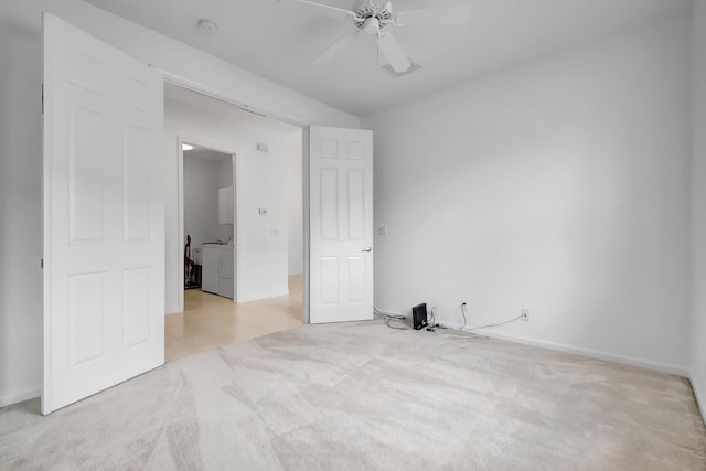 unfurnished bedroom with ceiling fan, baseboards, carpet, and washer / dryer