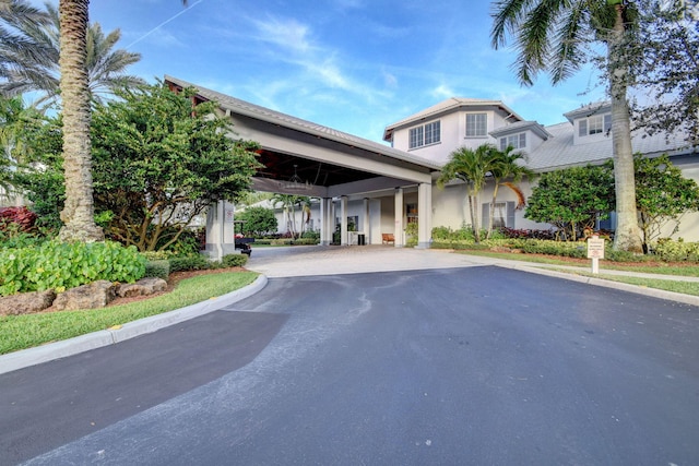 view of property featuring aphalt driveway