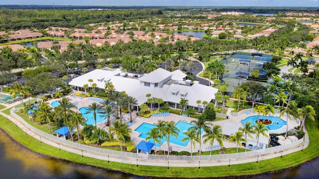 drone / aerial view with a water view and a residential view