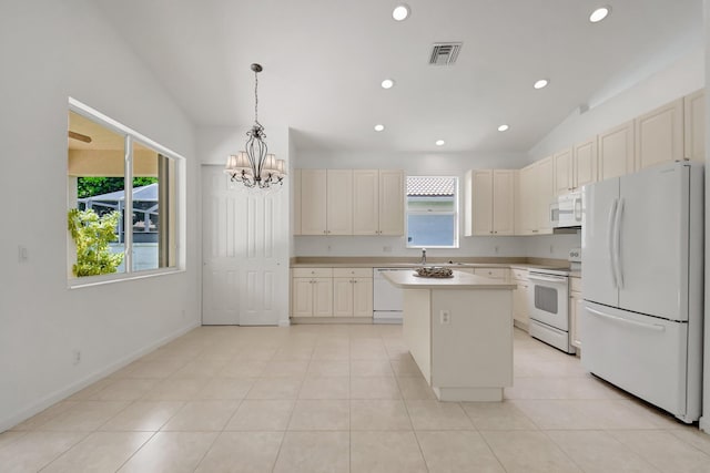 kitchen with visible vents, a wealth of natural light, white appliances, and a chandelier
