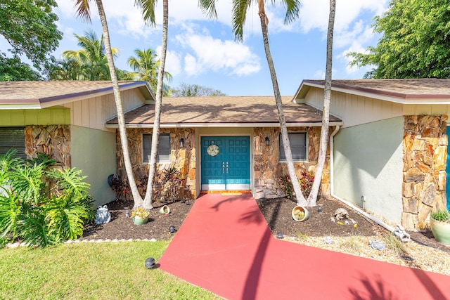 267 Old Country Rd S, Wellington, FL 33414 - view of front facade with roof with shingles and stone siding