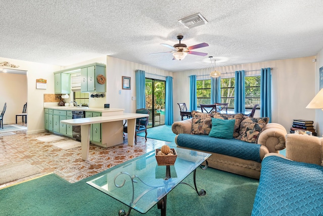 267 Old Country Rd S, Wellington, FL 33414 - living room with visible vents, ceiling fan, and a textured ceiling