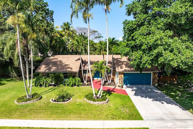267 Old Country Rd S, Wellington, FL 33414 - mid-century modern home featuring an attached garage, concrete driveway, and a front lawn