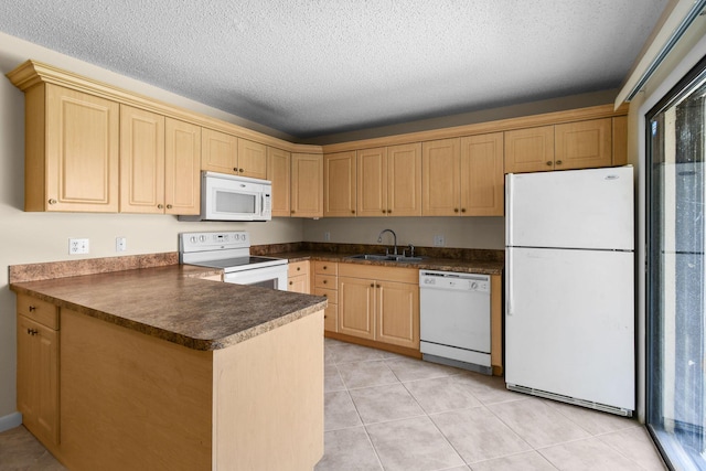 3203 Meridian Way N Unit D, Palm Beach Gardens, FL 33410 - kitchen with white appliances, dark countertops, a sink, a peninsula, and light brown cabinets