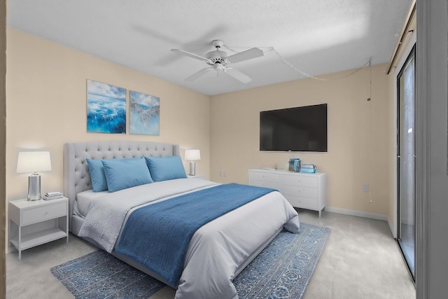 bedroom with light carpet, baseboards, and a ceiling fan