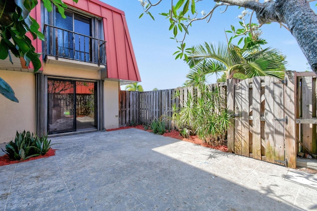view of patio featuring fence