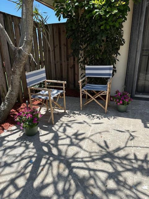 3203 Meridian Way N Unit D, Palm Beach Gardens, FL 33410 - view of patio with fence
