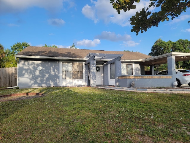 ranch-style home featuring fence, a front lawn, stucco siding, a shingled roof, and a pergola