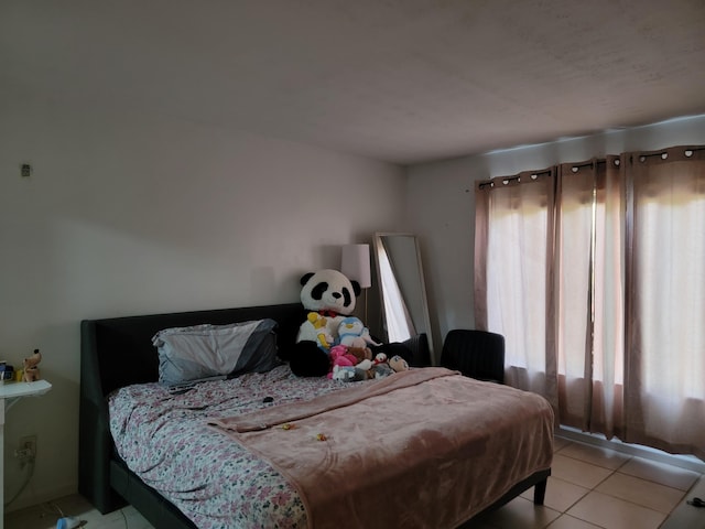 bedroom featuring light tile patterned floors