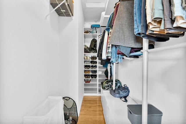 spacious closet with wood finished floors